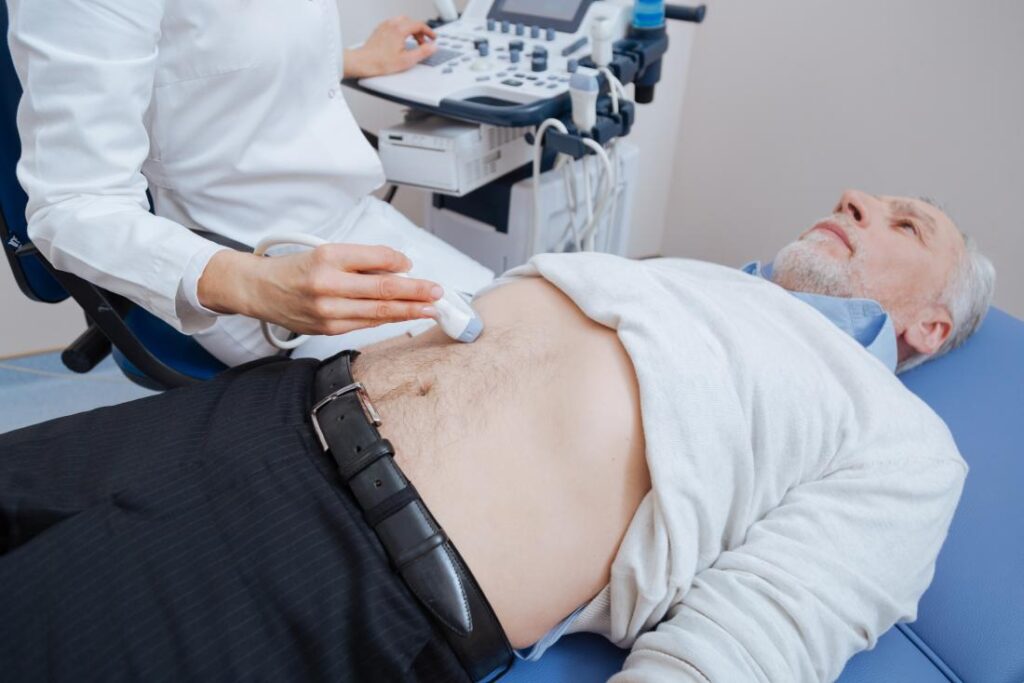 Ultrasound in Pediatrics, Men having abdominal ultrasound in a clinic, representational image source internet